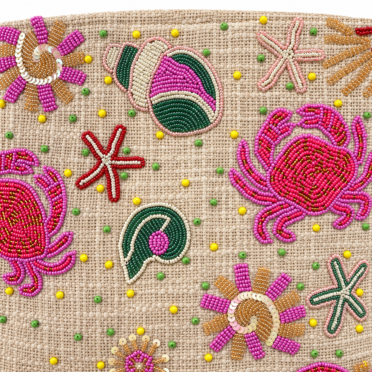 Close up of the hand beaded crabs, starfish and sequinned spiral shells on the Piti Cuiti shopper