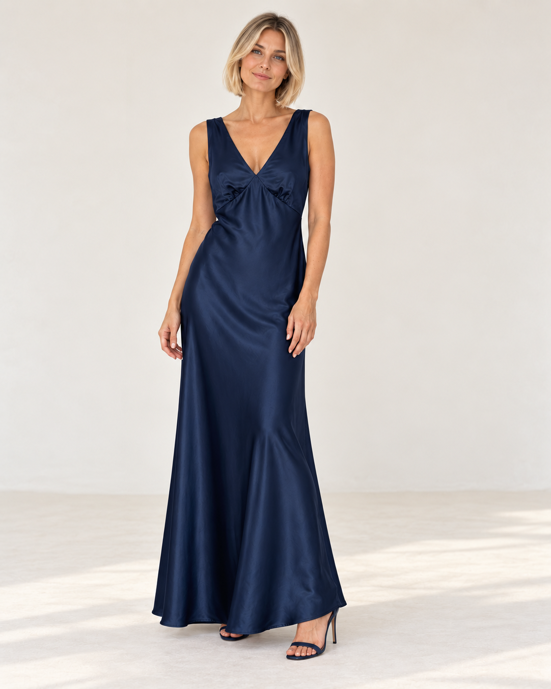 La Petite Étoile Rosily twist back satin midi dress in marine, front view on model