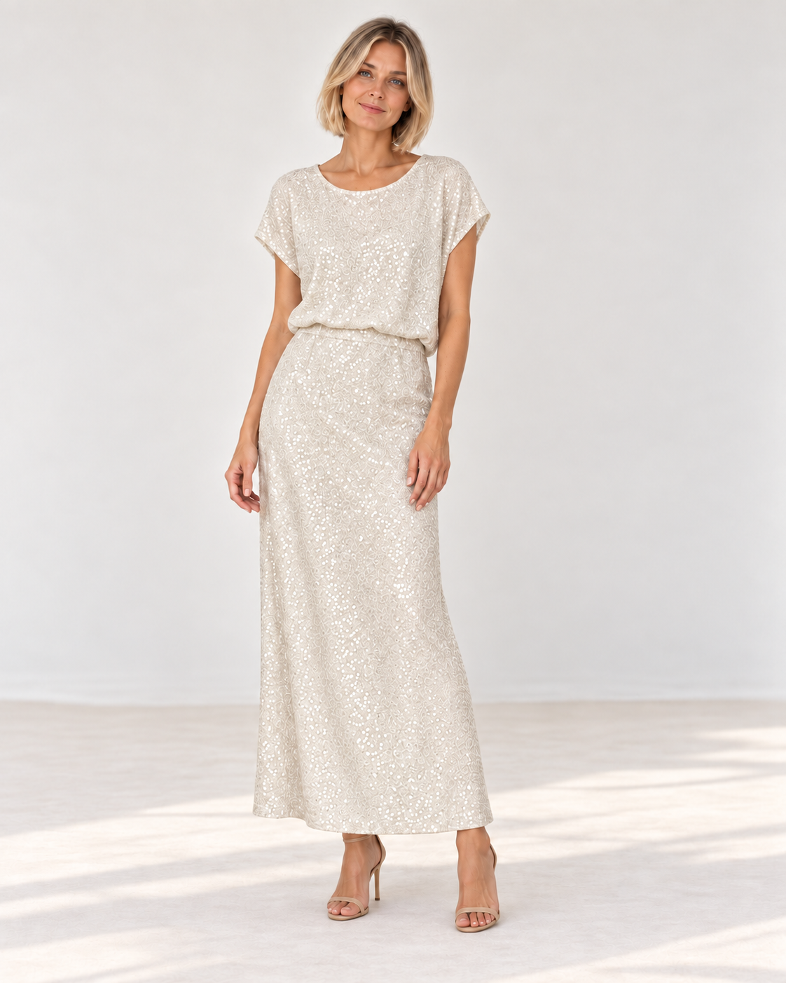 Model wearing the Smashed Lemon sequin maxi skirt in sand with the matching Sequin Top in Sand