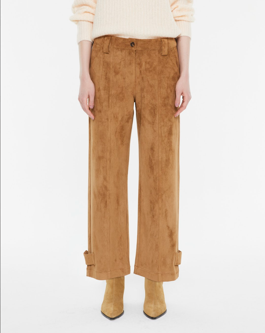 Model wearing Andam camel tailored trousers with knitwear
