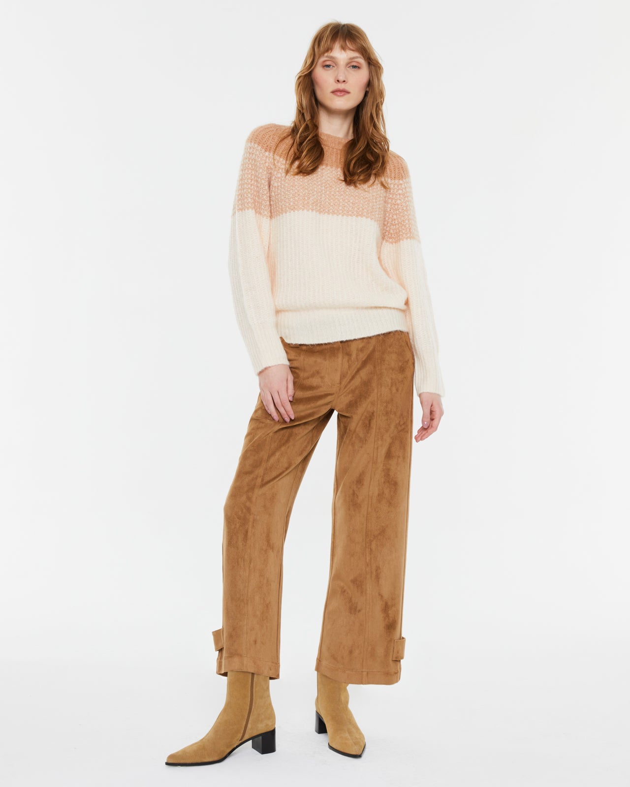 Andam peach and cream knit sweater front view on model