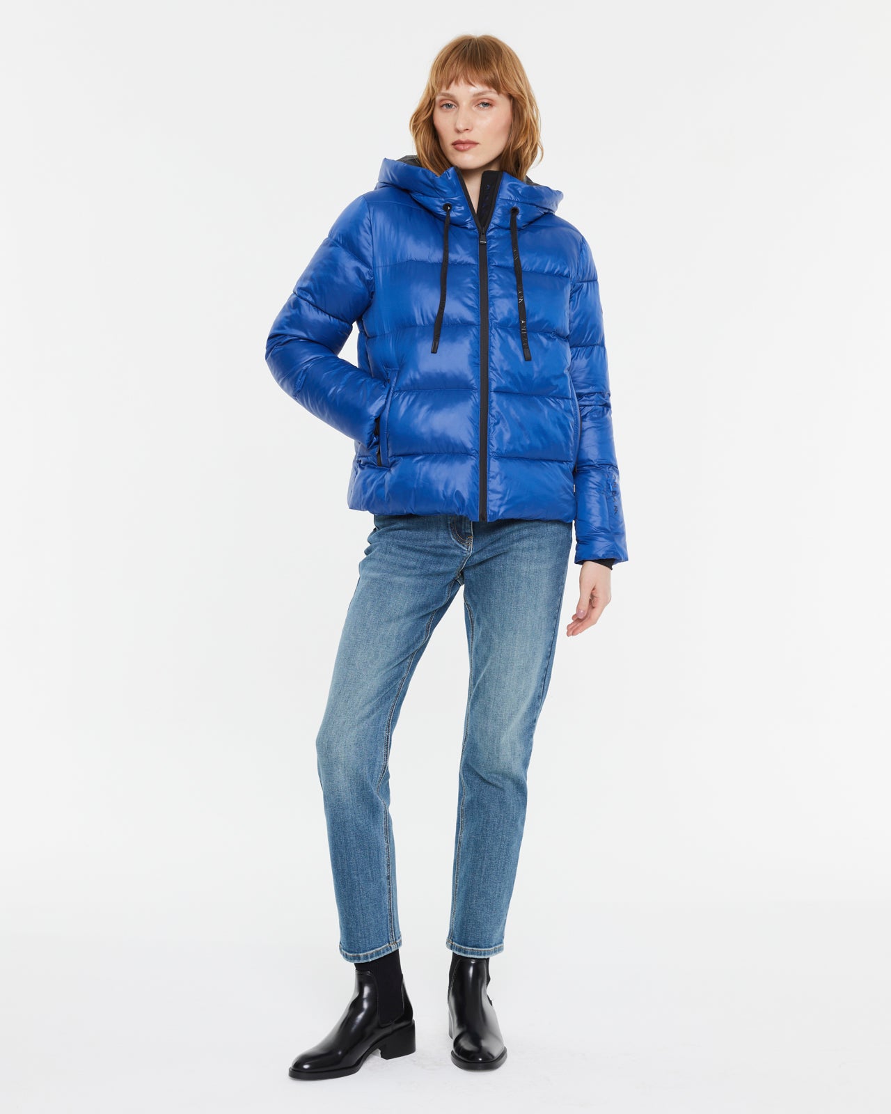 Andam blue hooded puffer parka full length front view on model