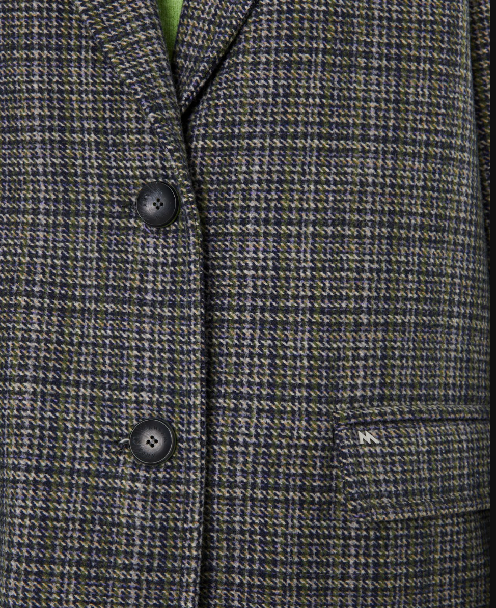 Close-up detail of the Andam Tailored Coat in grey check highlighting the classic checked wool-blend fabric, notch lapel, button fastening and tailored pocket detailing.