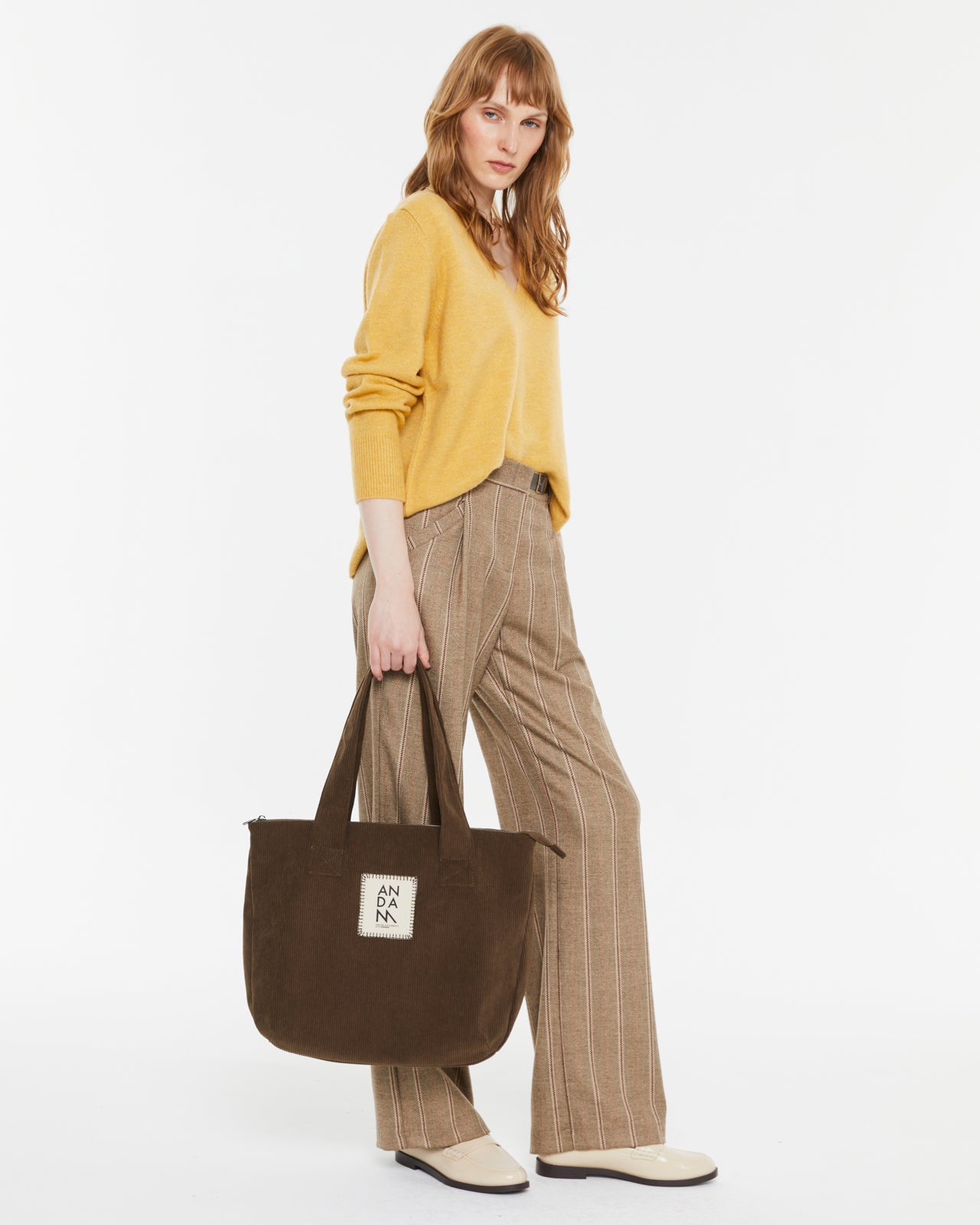 ANDAM V-Neck Jersey in Yellow styled with striped tailored trousers and tote bag