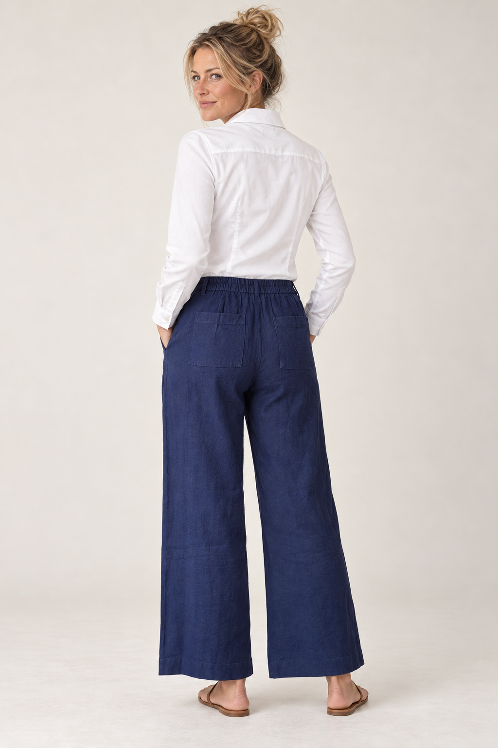 Back view of the Gordon Smith Lino Wide Leg Pant in Navy on model