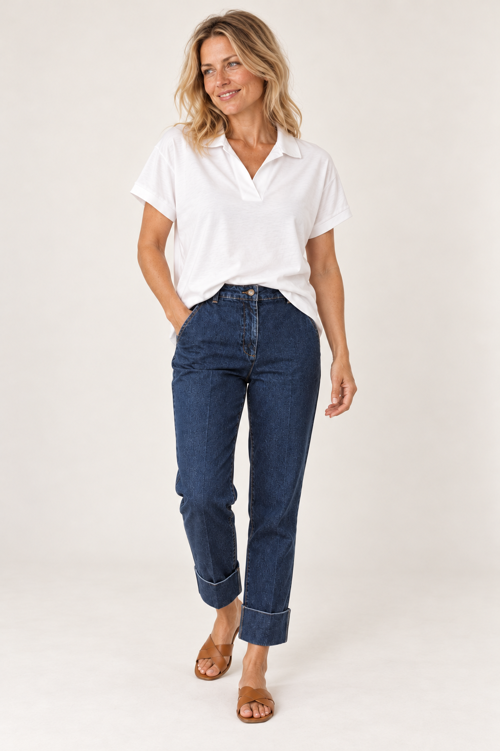 Gordon Smith Fairway Polo Top in White worn walking, with La Petite Étoile Parly Dark Blue jeans