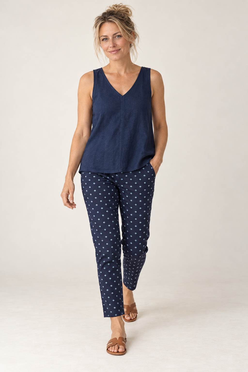 Gordon Smith Tropez Print Pant in Navy & White worn walking, with the Tilly Linen Cami in Navy