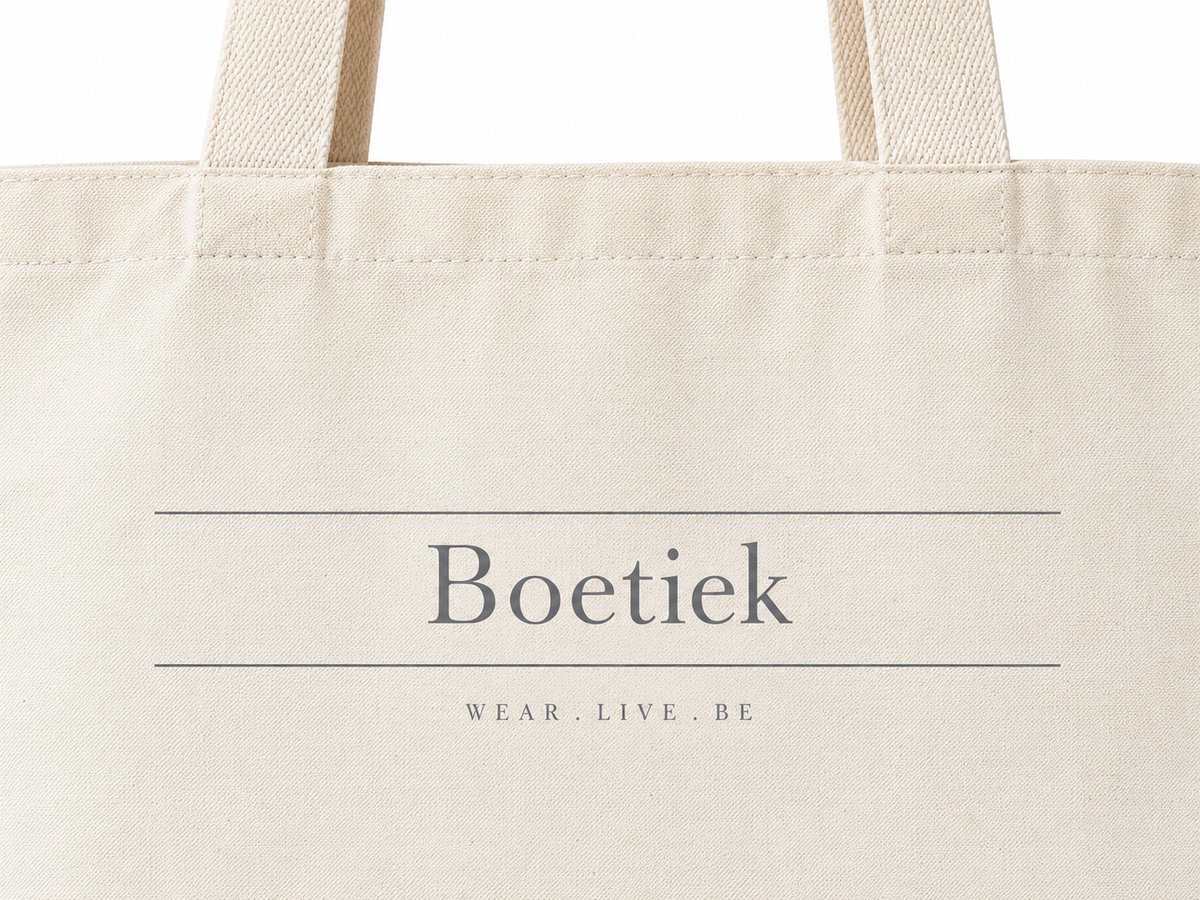 Close-up of the Boetiek wordmark and Wear. Live. Be printed in grey
