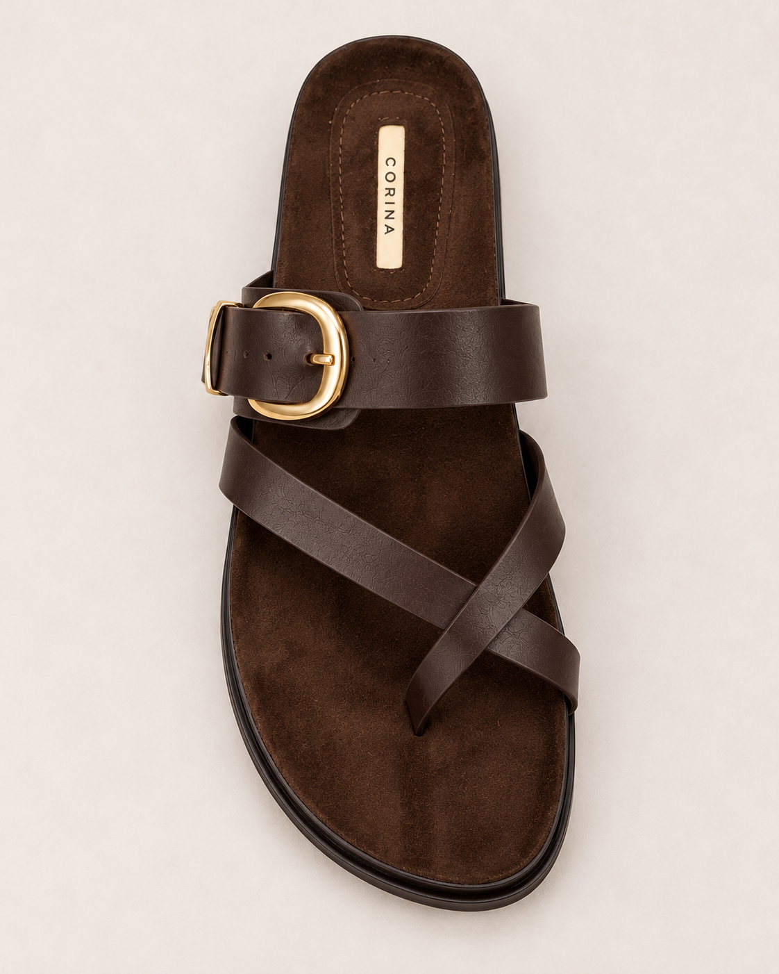 Corina Flat Sandal in Café, top view showing gold buckle fastening, crossover toe straps and dark brown footbed