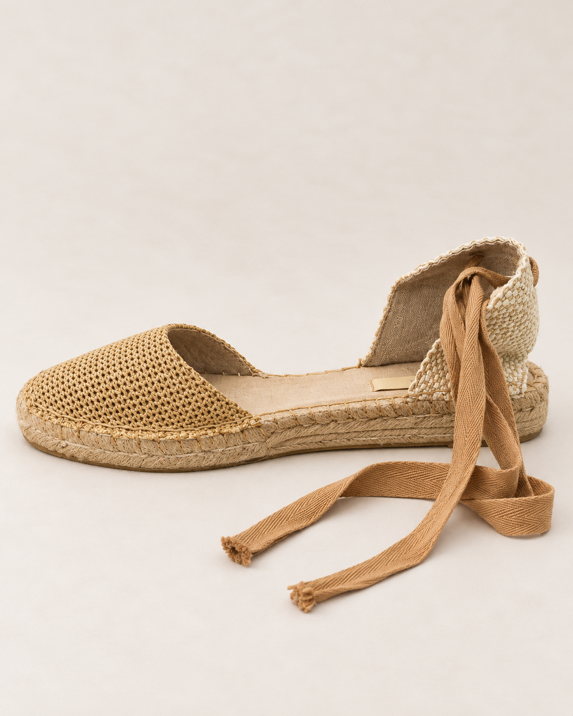 Corina Wedge in Camel, side view showing woven toe, low jute wedge sole and adjustable ankle ties
