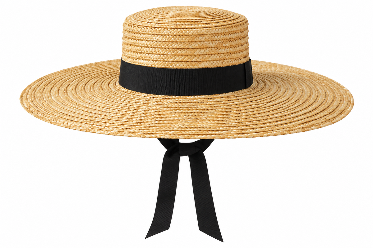 Front product view of Crystal Birch Sam Bolero Straw Hat in Natural showcasing its structured flat crown, oversized circular brim, black hatband and long black ribbon ties