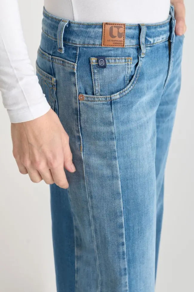 Close-up of the front pocket and vintage denim wash on the Lauryn Jeans.