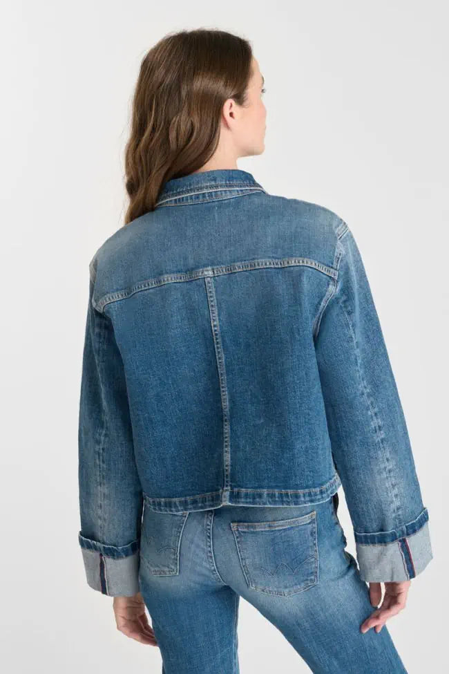 Back view of model wearing the Le Temps des Cerises Aleska cropped blue denim jacket.