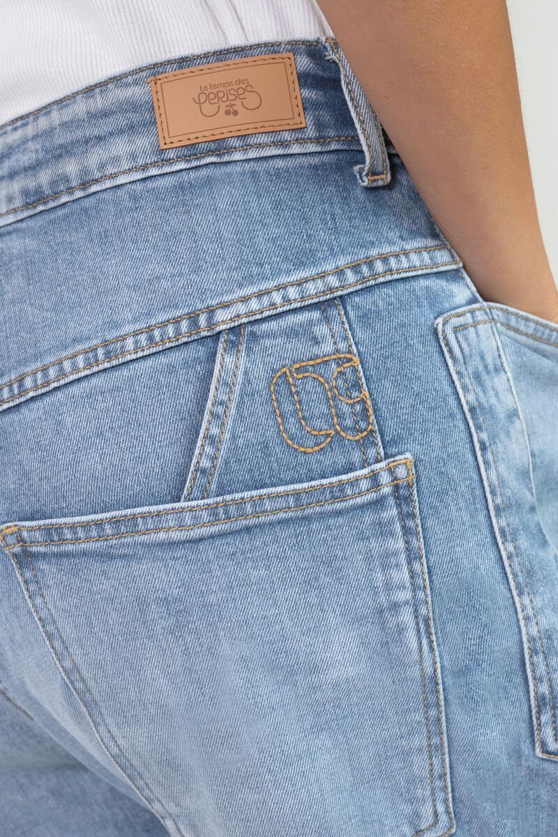 Close-up of back pocket detail and logo embroidery on Le Temps des Cerises Madie jeans in light blue