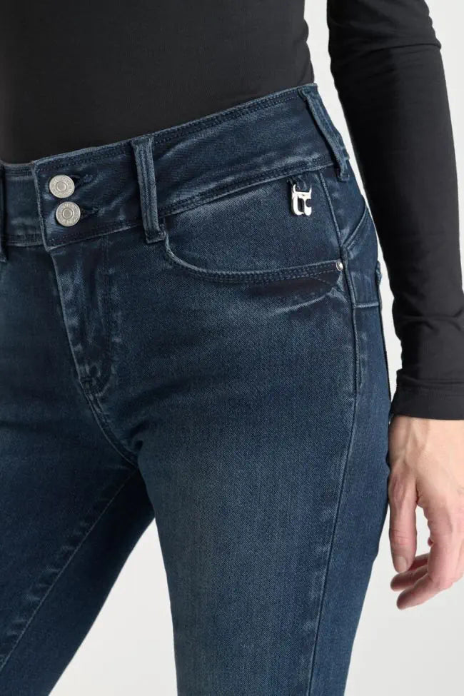 Close-up of the Le Temps des Cerises Ultra Pulp Slim Evy jeans showing the double-button waistband and signature metal logo detail.
