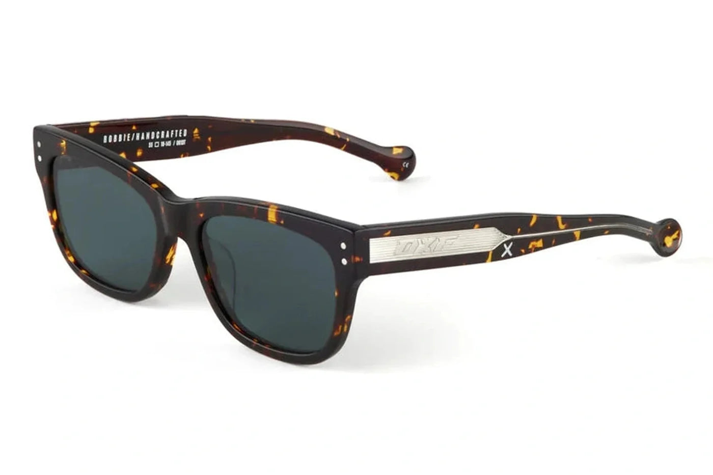 Angled view of Oscar X Frank Robbie sunglasses in dark tort featuring square acetate frames, dark lenses and signature temple detailing.