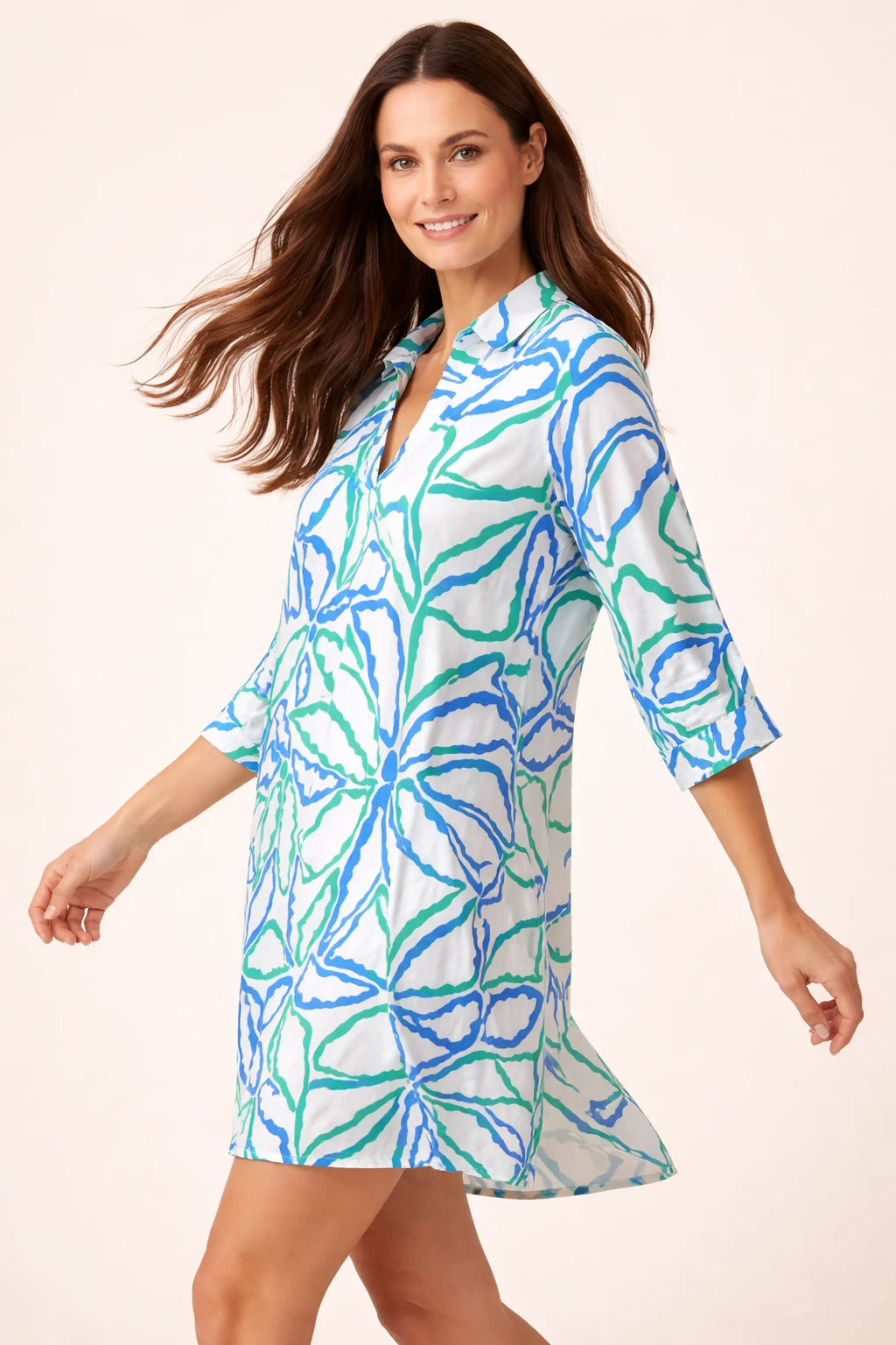 Model walking and wearing Smashed Lemon cobalt blue green printed dress