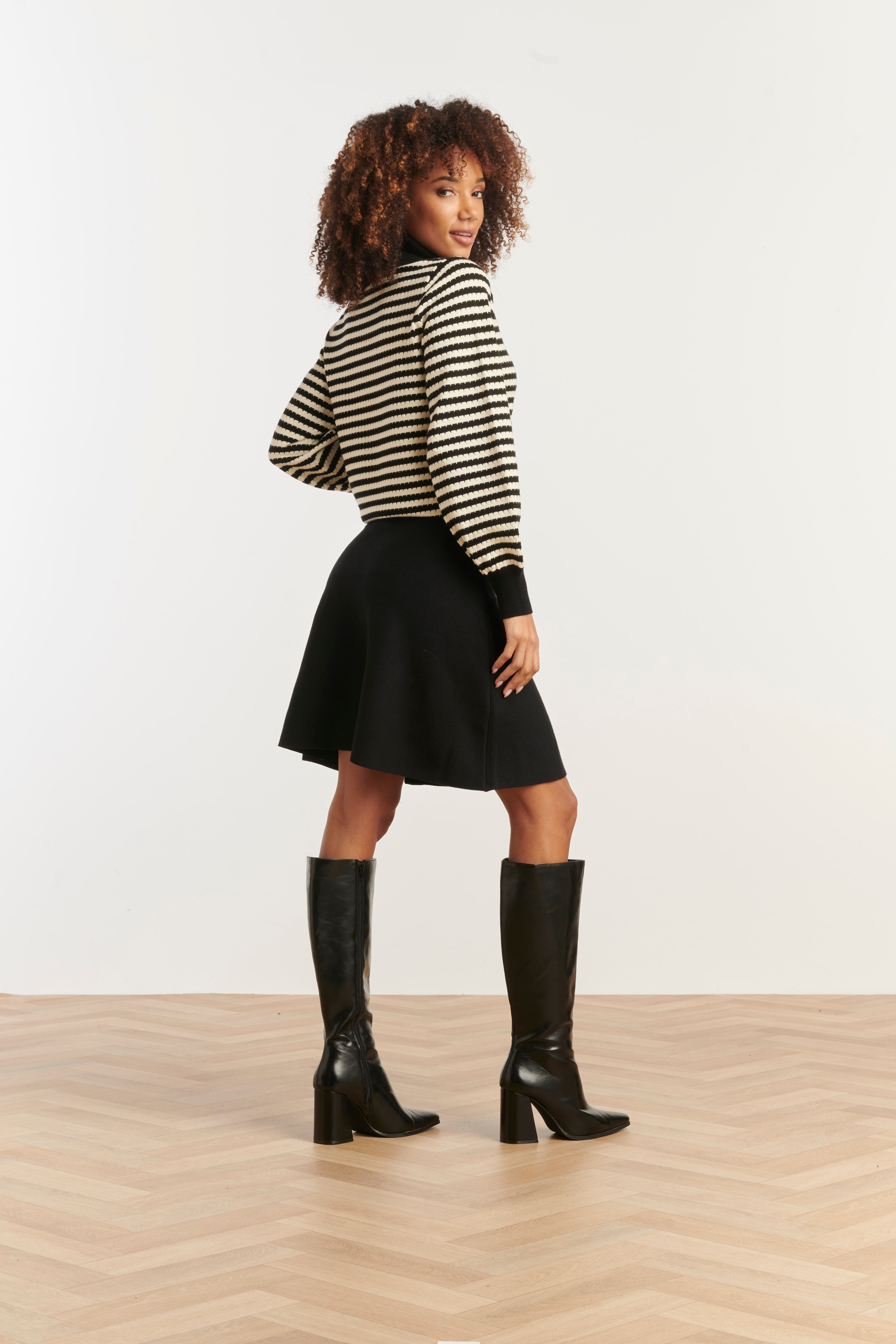 Smashed Lemon knit skirt in black, A-line silhouette, knee-length, side view