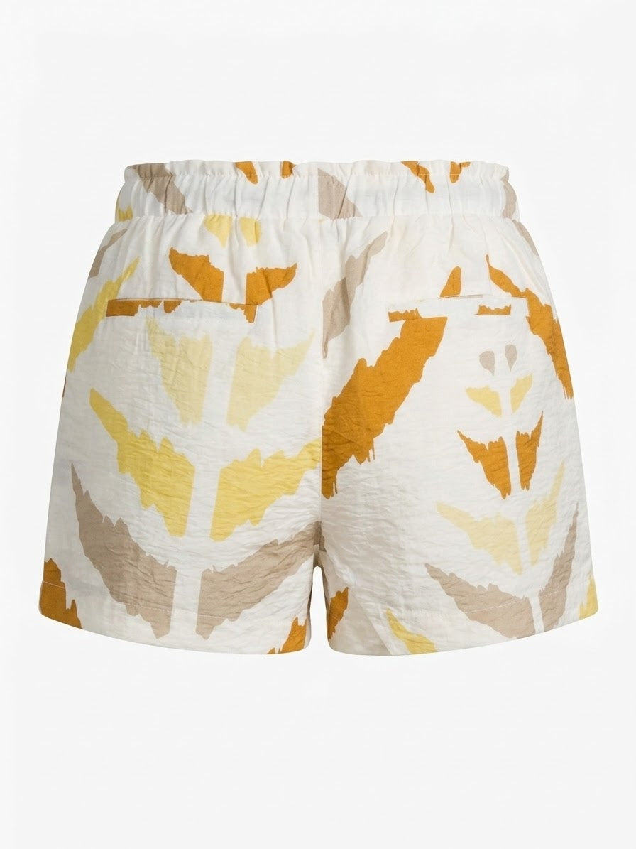 Smashed Lemon printed shorts in white and yellow back view with elasticated waistband and back pocket