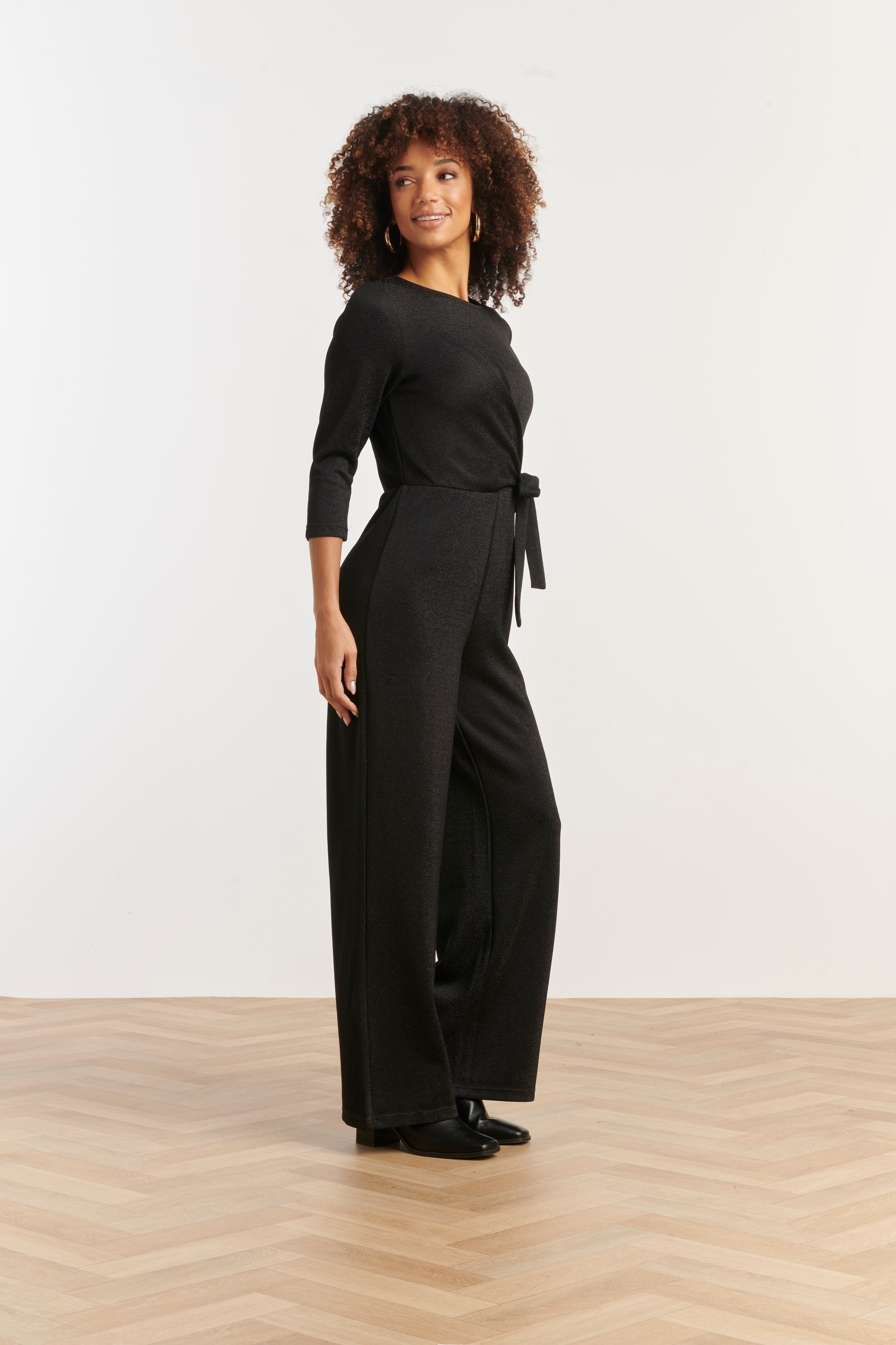 Smashed Lemon wrap jumpsuit in black with three-quarter sleeves and wide leg, three-quarter angle view