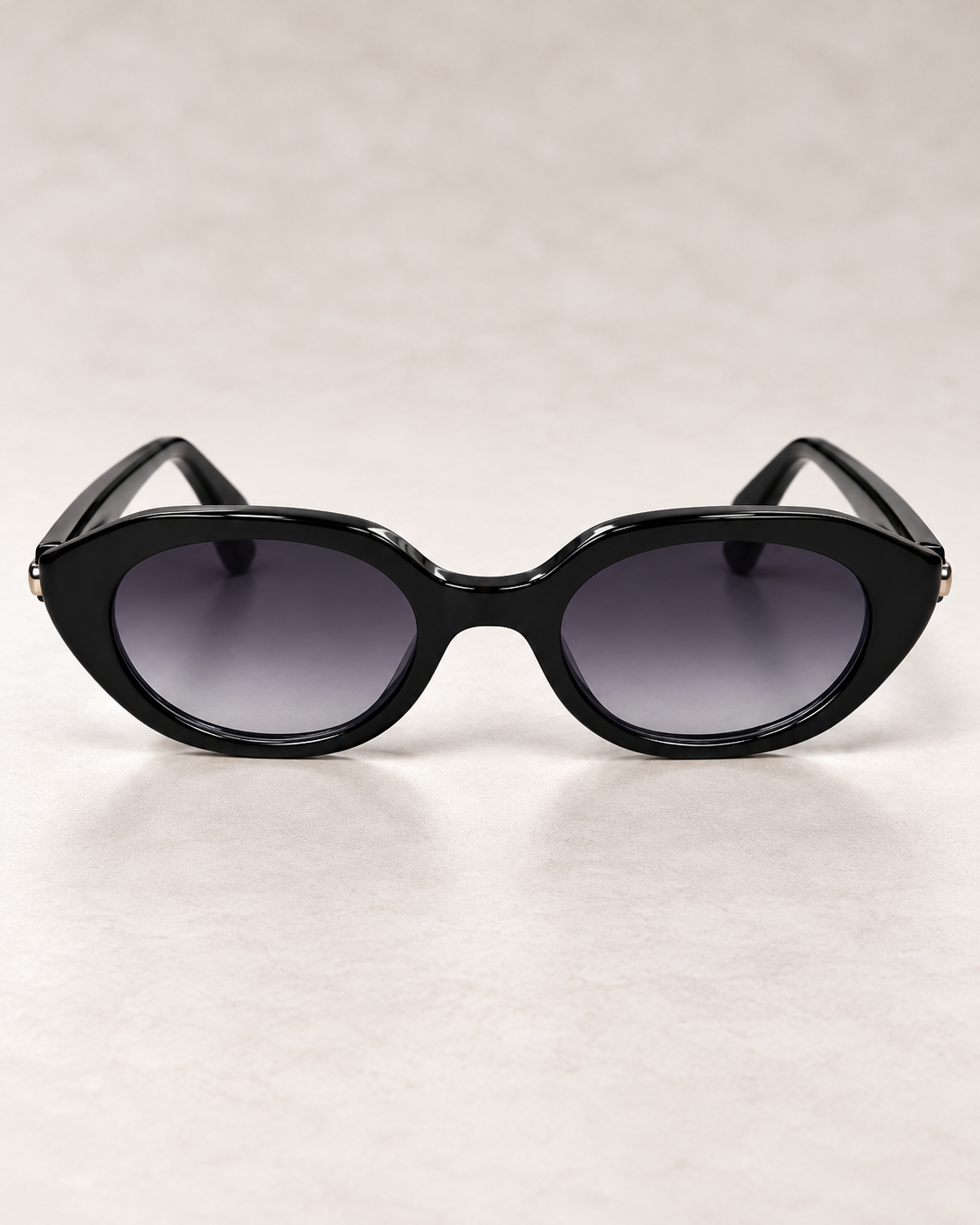 YAYA Florence Sunglasses in black, featuring a glossy black retro oval frame and dark gradient lenses