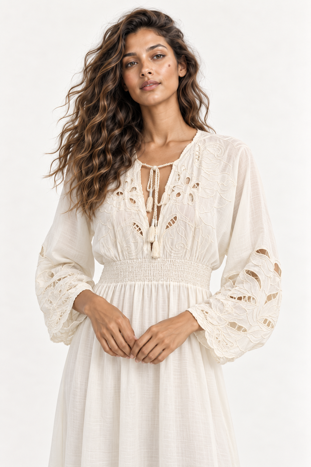 Close up of the plaited tassel tie neck, cutwork yoke and shirred waistband on the Piti Cuiti maxi dress