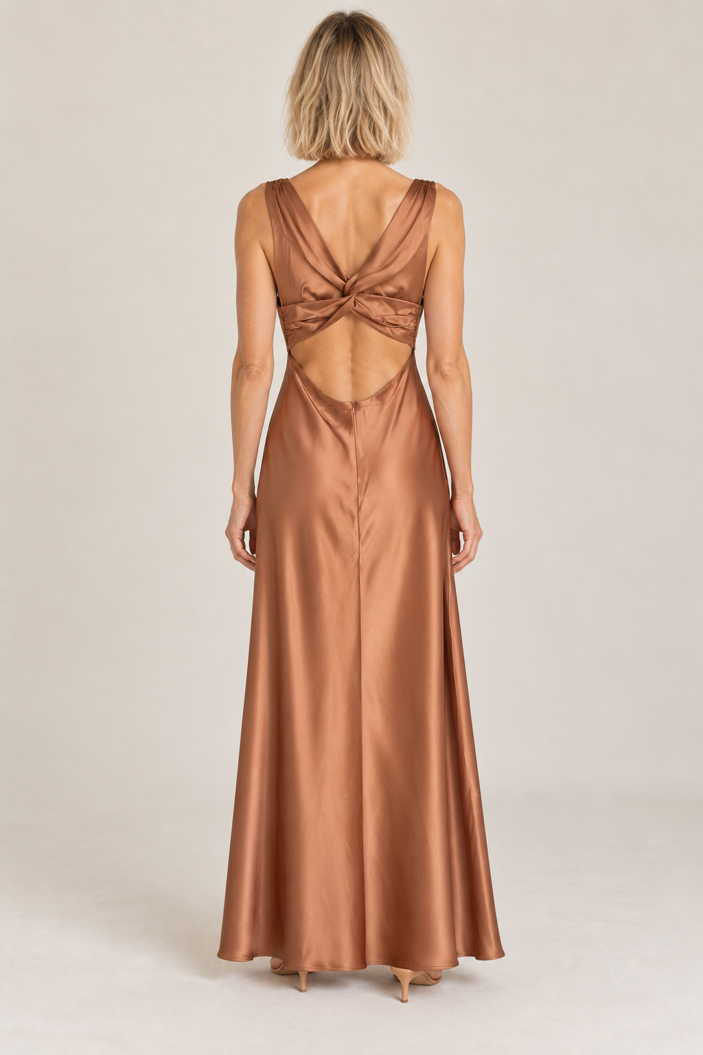 Back view of the Rosily camel satin dress showing the open twist back
