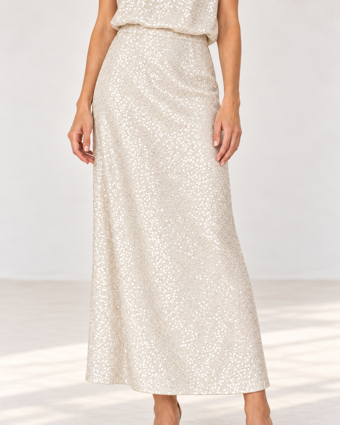 Close-up of the Smashed Lemon sequin maxi skirt in sand showing the sequins and embroidery
