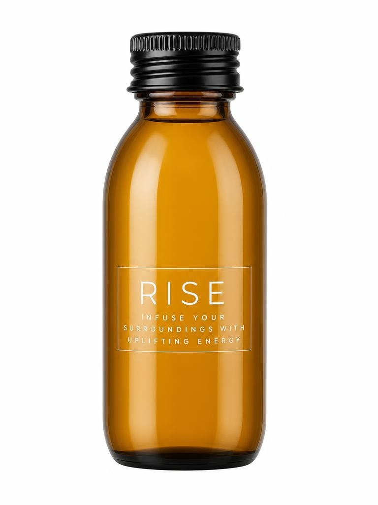 Soje Rise diffuser with amber fragrance bottle and black sculptural vessel
