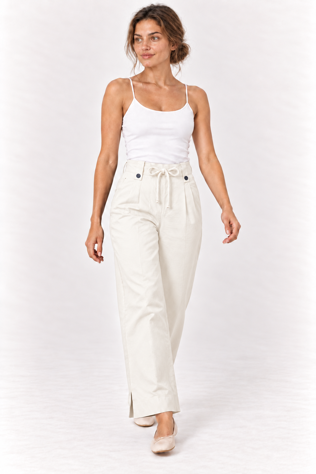 Model walking in the YAYA Drawstring Wide Leg Trousers in Off White, showing the wide leg #Colour_White