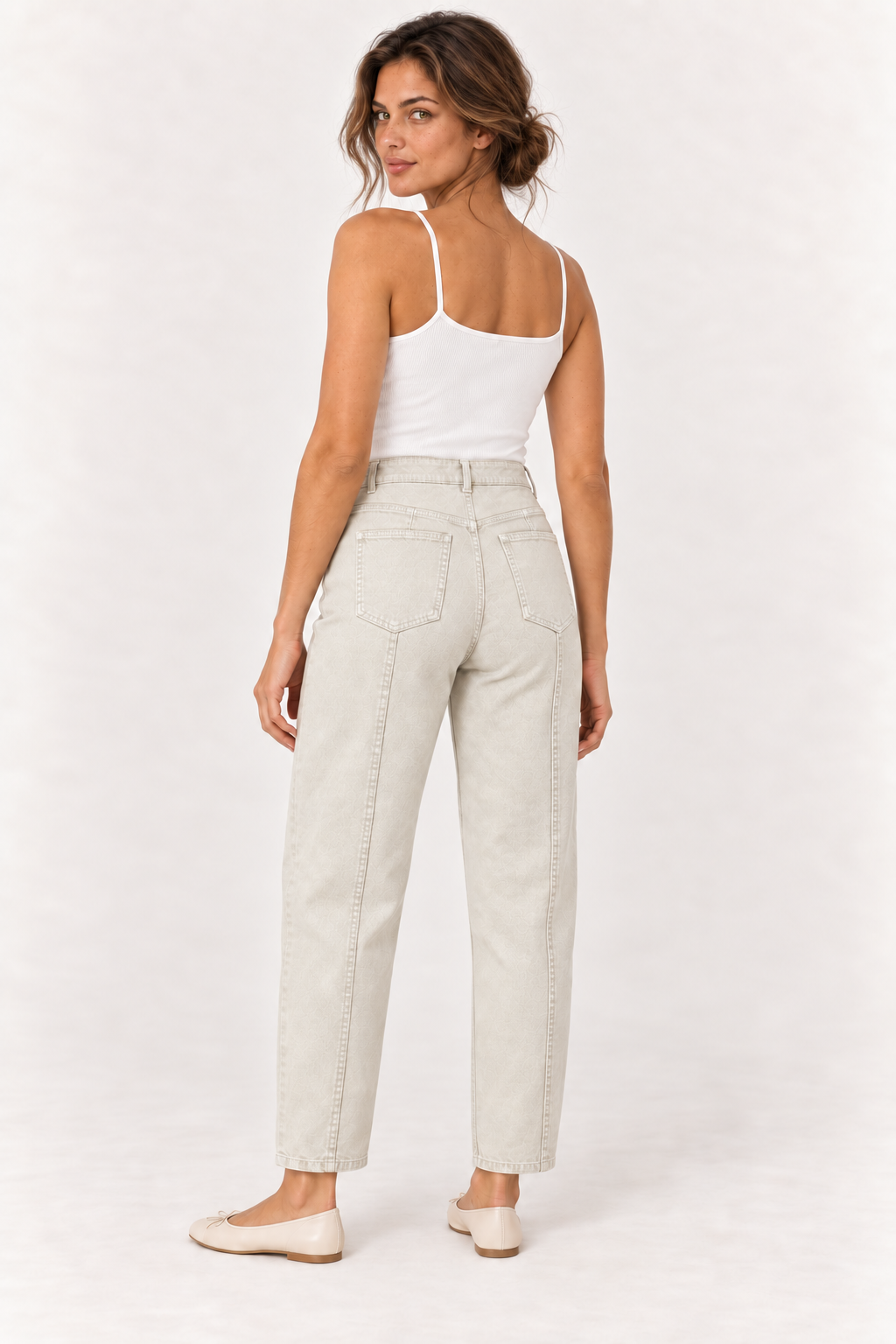 Model wearing the YAYA Tapered Leg Denim in Sandstone Beige, back view