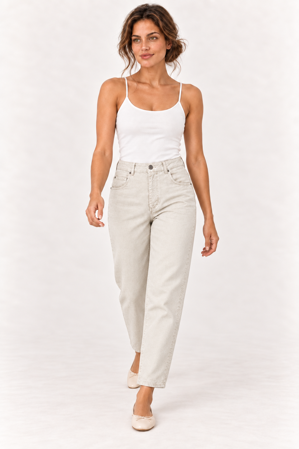 Model walking in the YAYA Tapered Leg Denim in Sandstone Beige