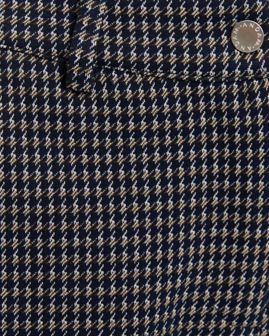 Close-up of navy and neutral check fabric on Andam trousers