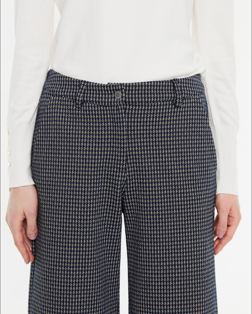 Detail of waistband and tailored fit on Andam navy check trousers
