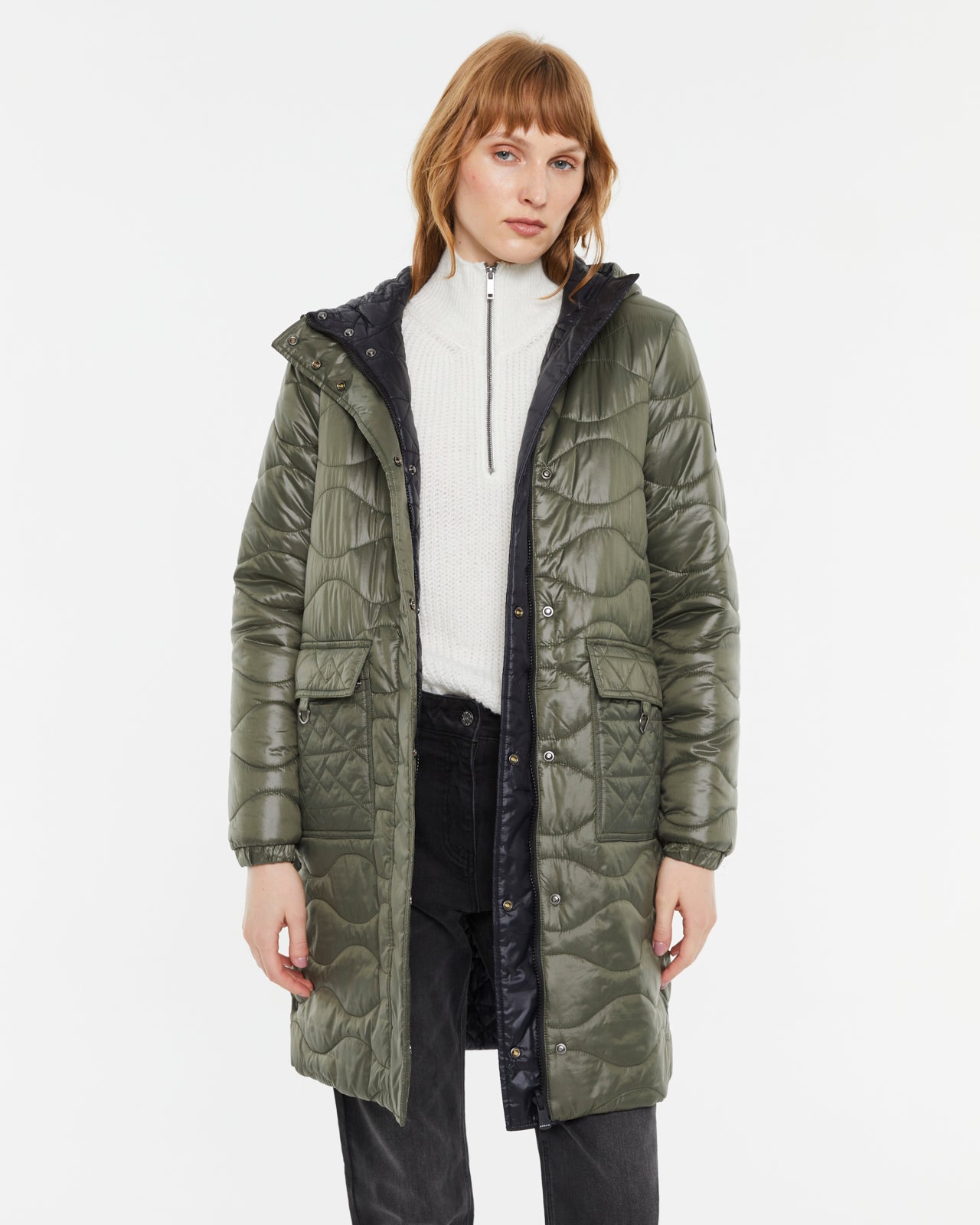 Andam quilted parka in khaki featuring wave quilting, hood, flap pockets and snap-button closure
