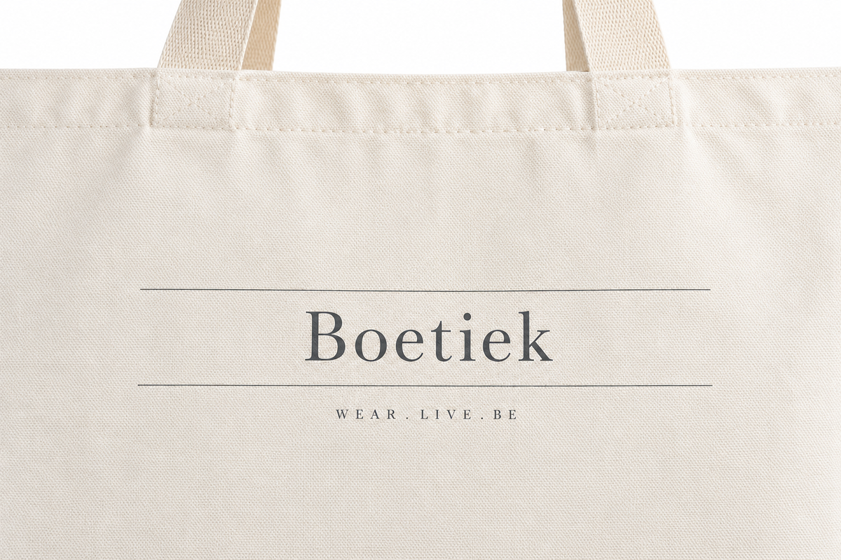 Close-up of the Boetiek wordmark and Wear. Live. Be printed in grey