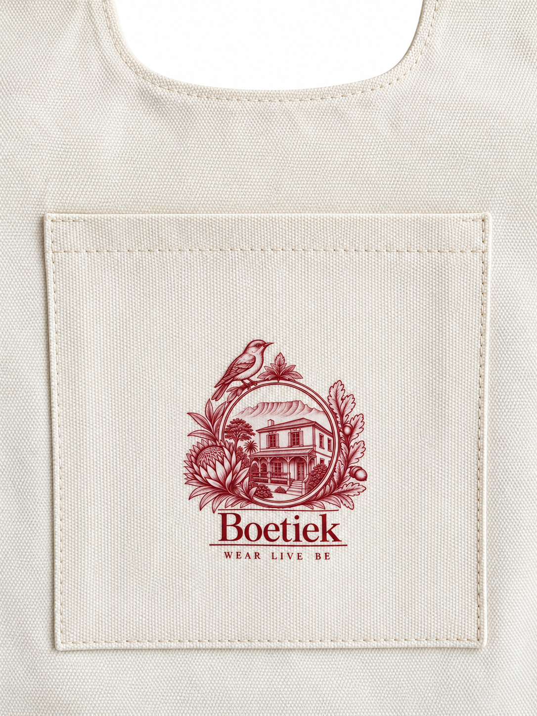 Close-up of the front pocket with the Boetiek logo printed in burgundy
