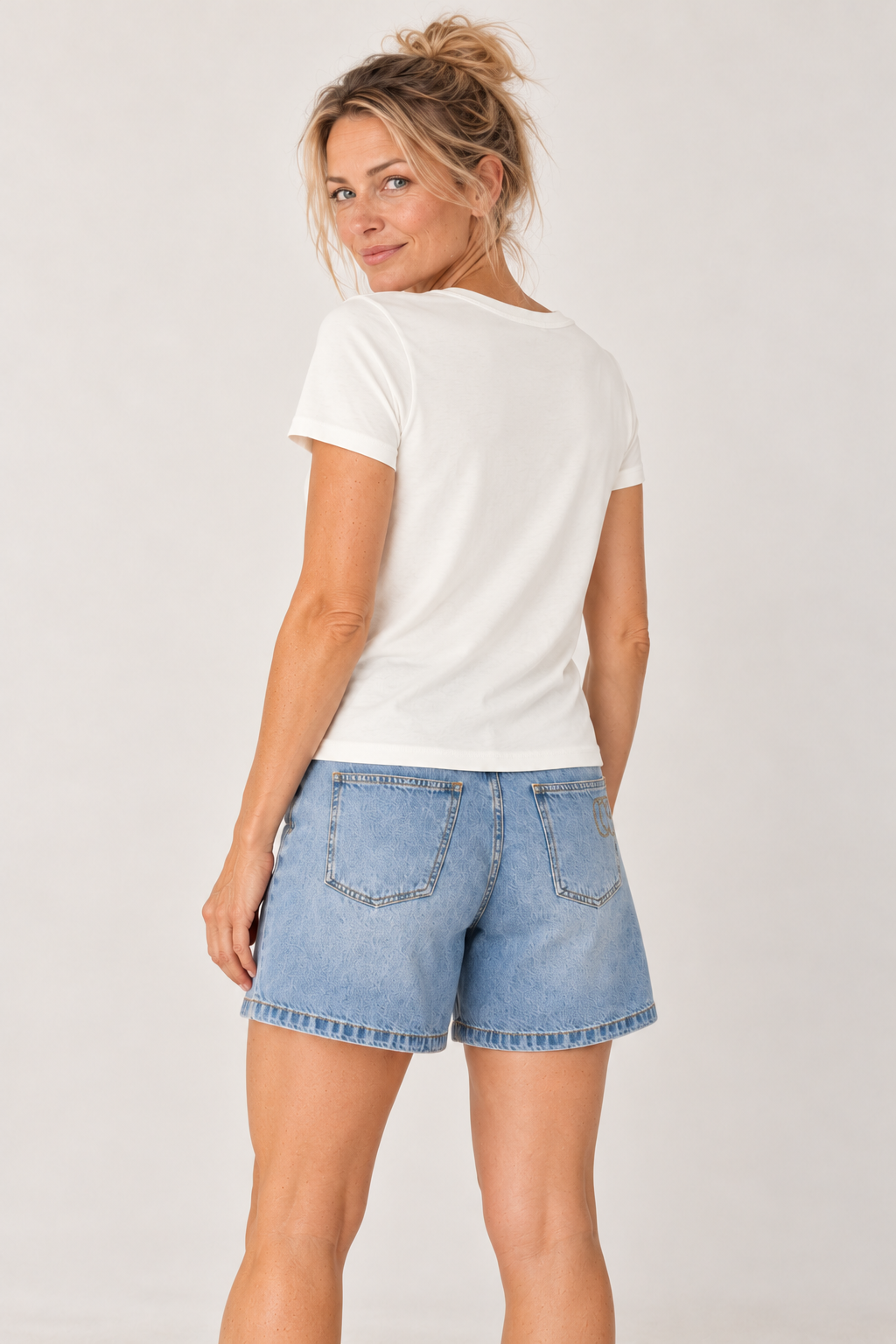 Back of the YAYA round neck T-shirt in Off White, worn with denim shorts #Colour_Off White