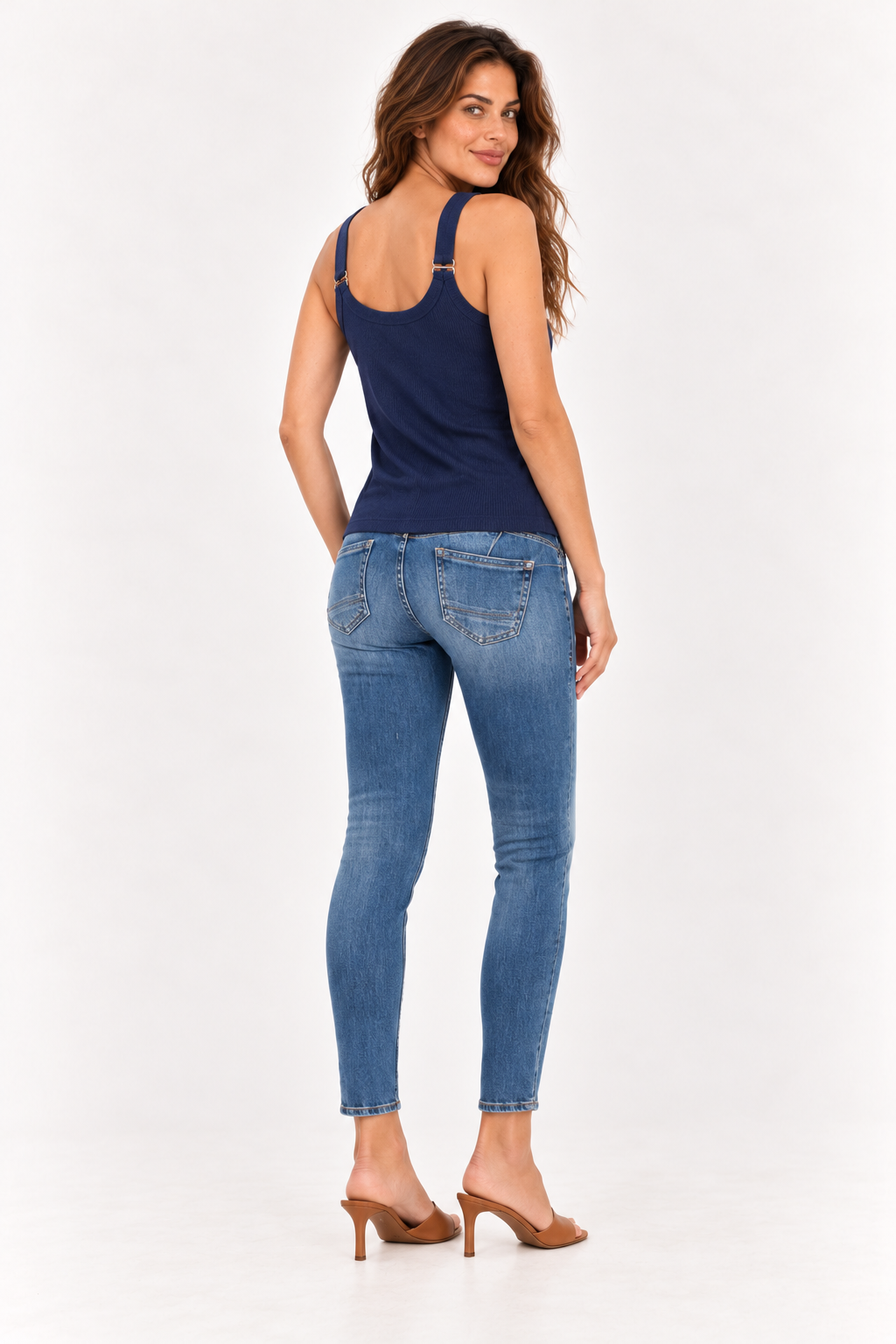 Back of the YAYA navy elastic strap singlet on the model, worn with skinny jeans