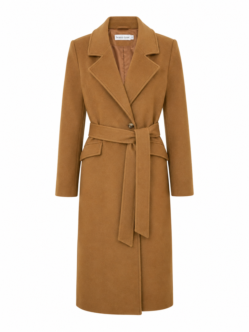 Front view of the Brave & True Julianne Coat in Camel featuring a tailored longline silhouette, belted waist and classic lapel collar.
