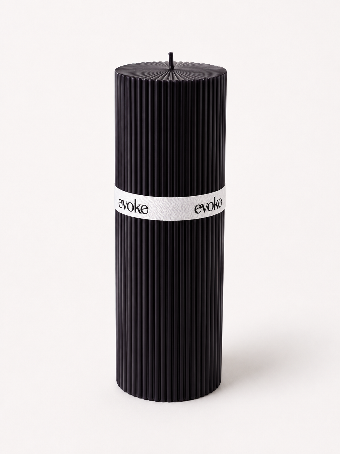 Evoke by Tanika large black pillar candle featuring a contemporary fine groove ribbed design and sculptural cylindrical silhouette.