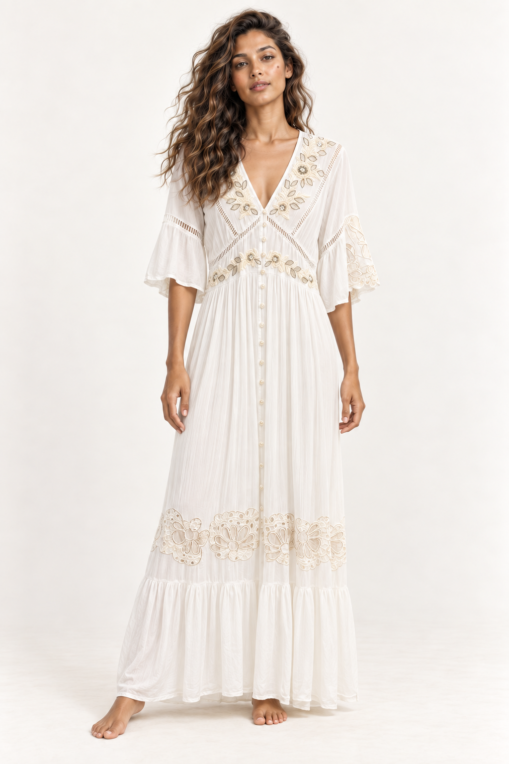 Model in the Piti Cuiti embroidered maxi dress, showing the flute sleeves and tiered cutwork hem
