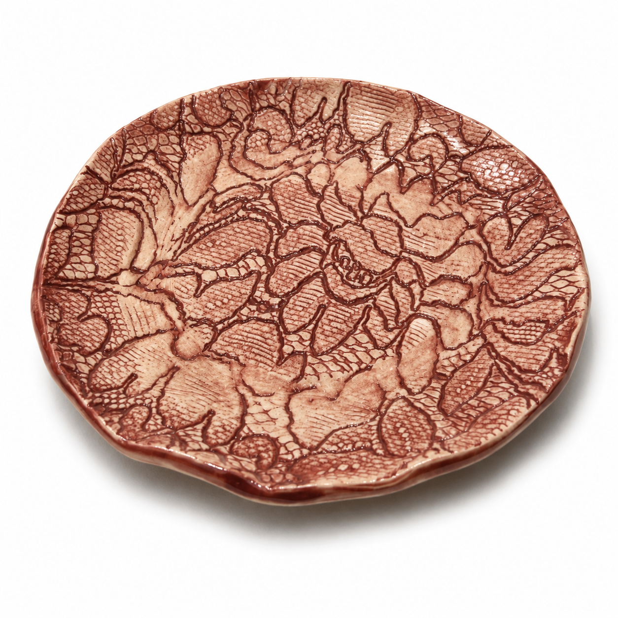 Handcrafted ceramic saucer by Fragile by Ilene in rose glaze with embossed botanical texture and organic artisanal finish