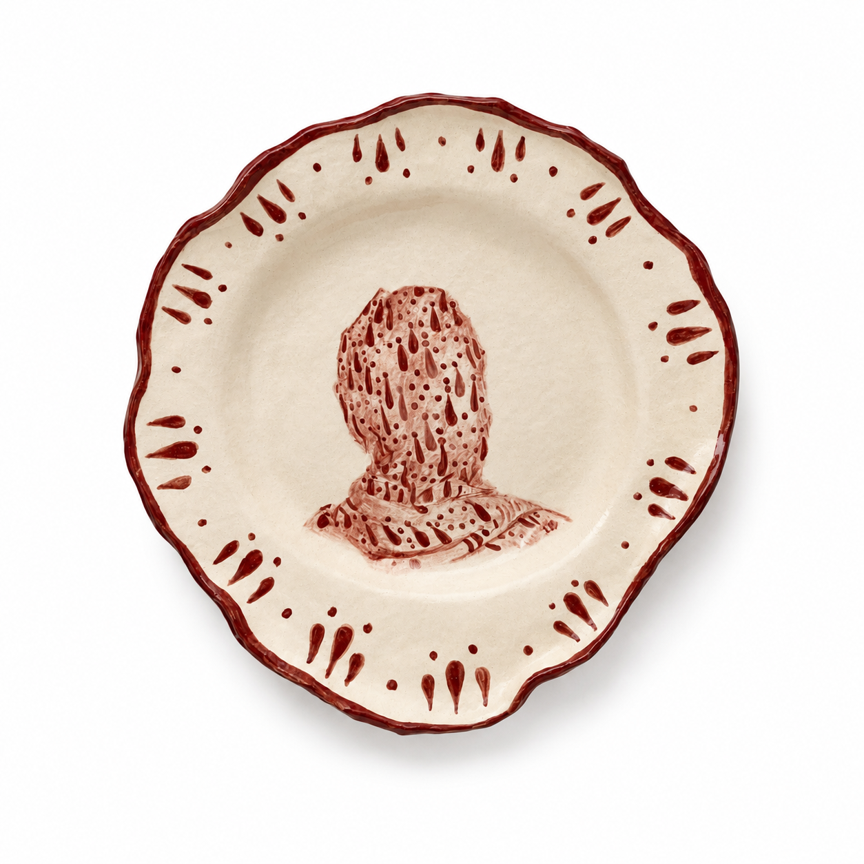 Handcrafted stoneware plate by Ilene Bothma featuring a hand-painted figurative motif with oxblood red detailing and an organic scalloped edge