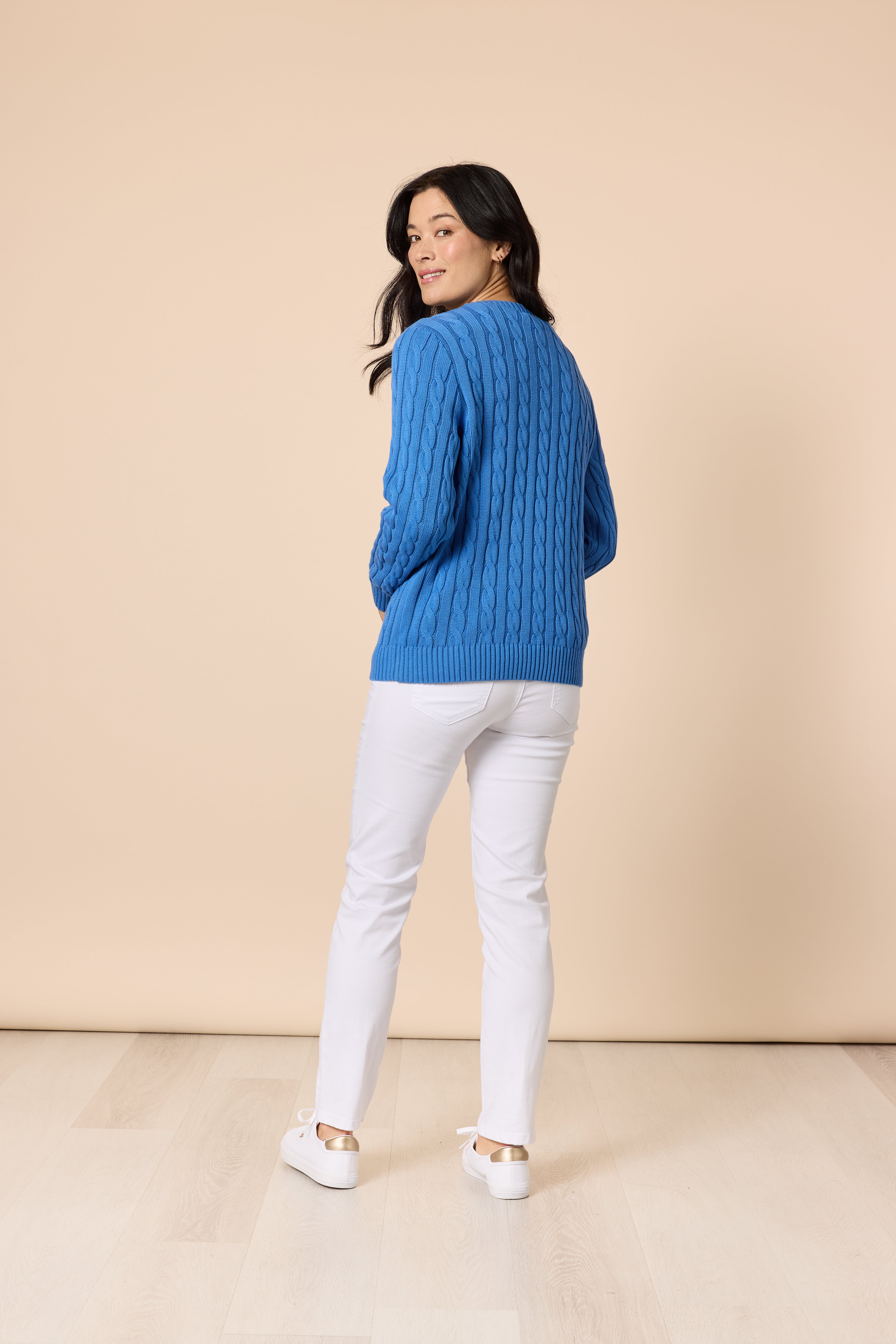 Back view of cobalt blue cable knit sweater