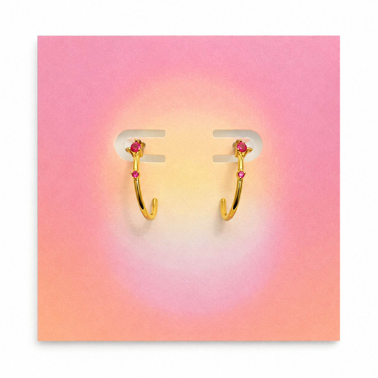 Jimnojean gold hoop earrings with pink crystal accents
