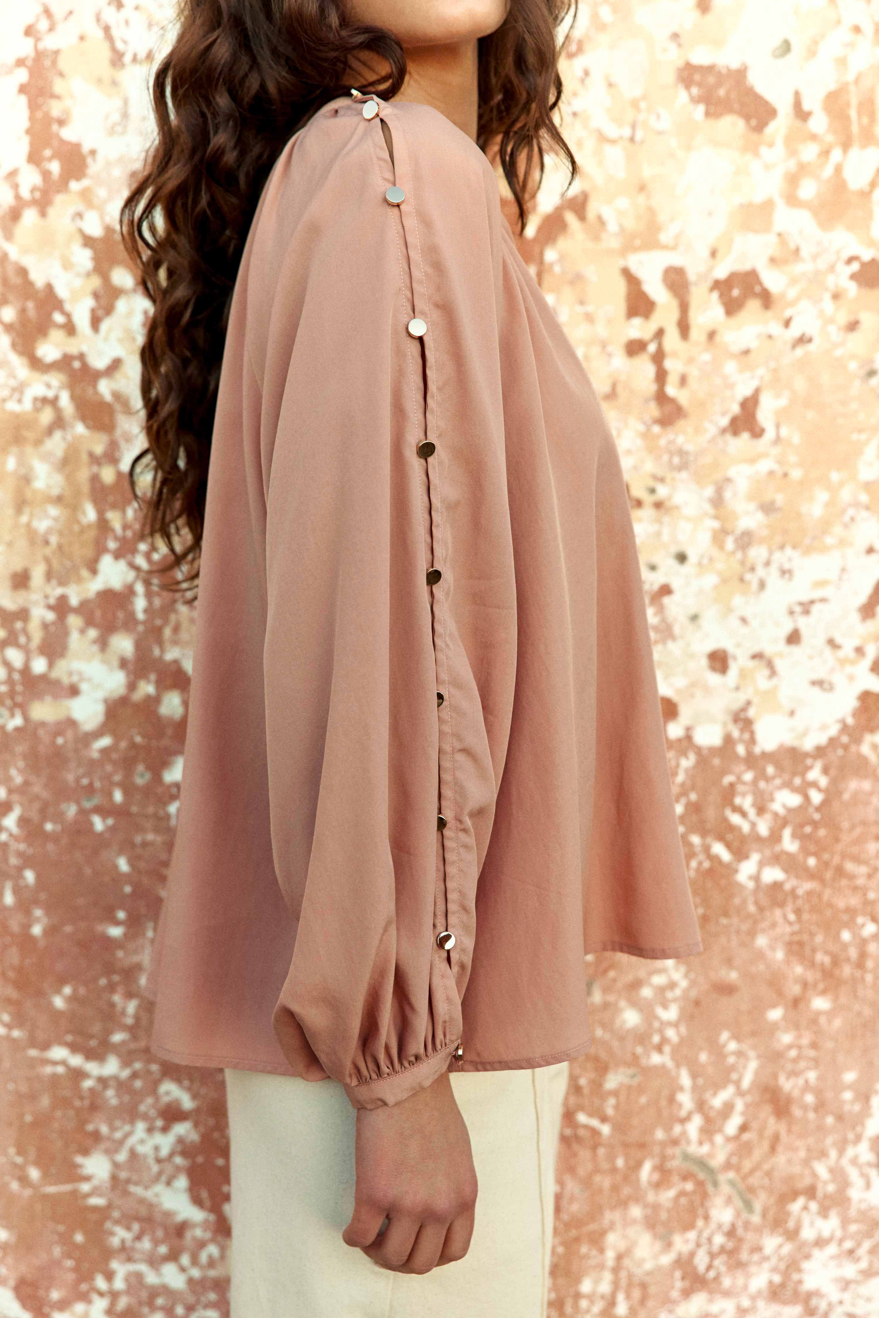 La Petite Étoile Bonnie blouse in blush showing metallic button detail along the sleeve