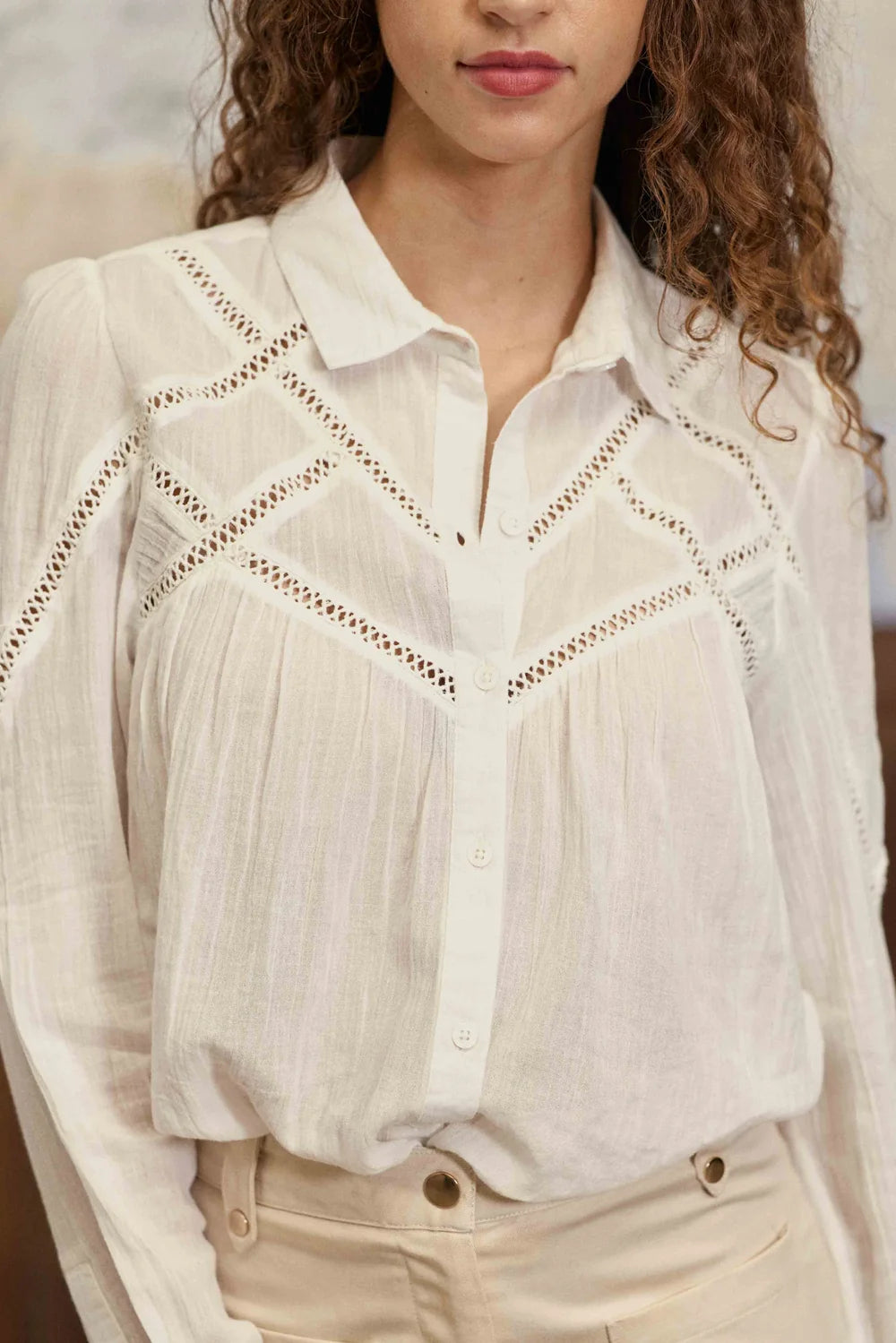 La Petite Étoile Cia blouse in ecru showing button front and geometric openwork detailing