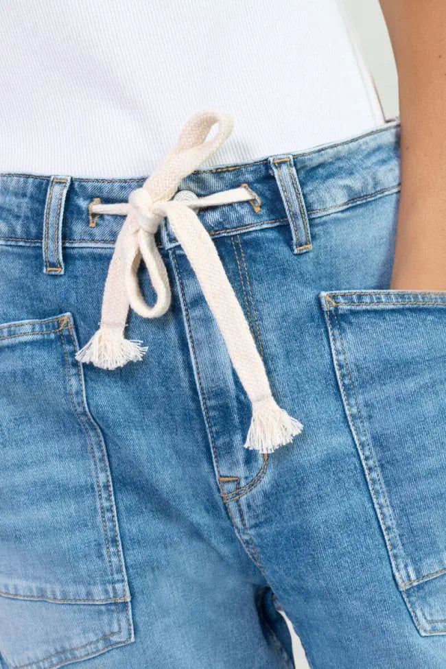 Close-up of the oversized front pockets and rope drawstring waistband on the Le Temps des Cerises Madie Denim Jeans in Blue.