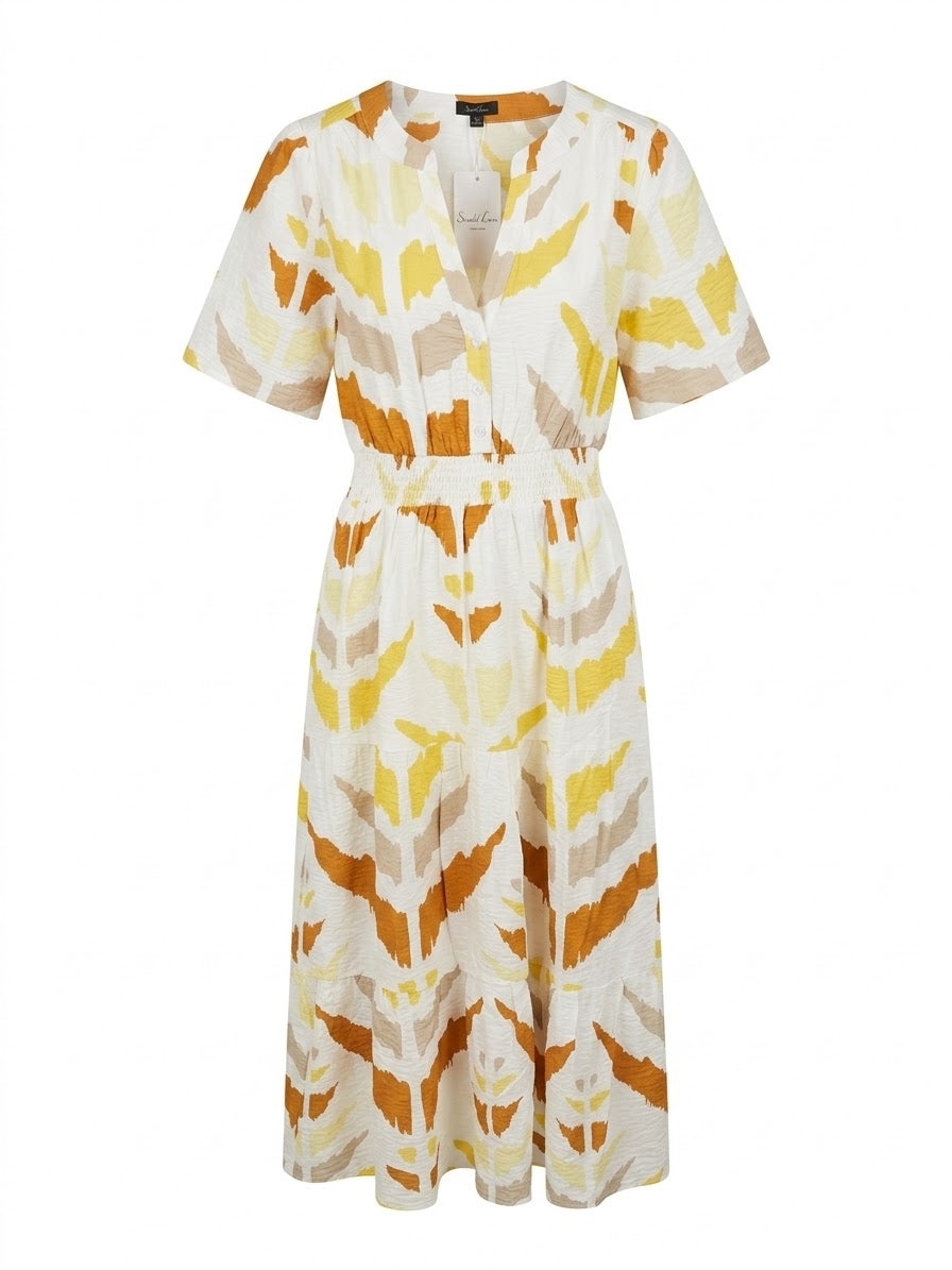 Smashed Lemon printed maxi dress in white and yellow with short sleeves, button front and shirred waist, front view.